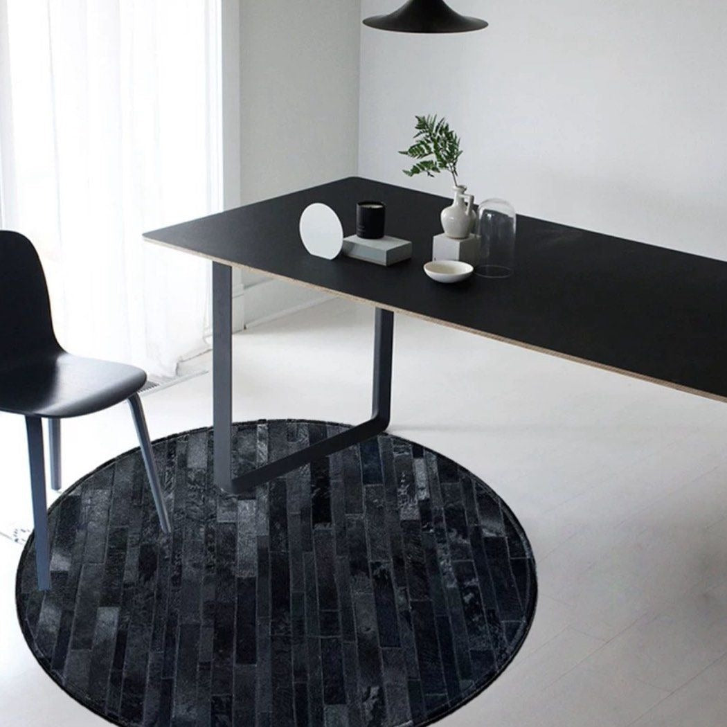 ALECTO Modern Round Cowhide Leather Rug