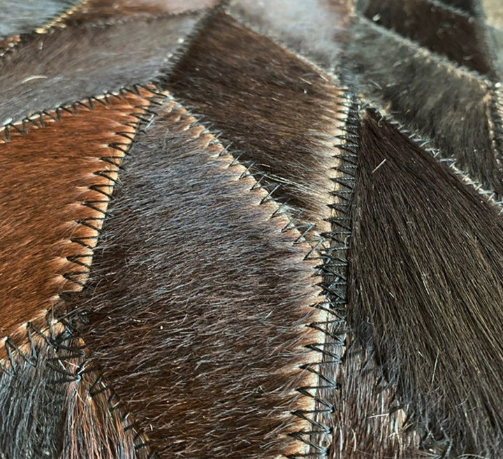 ALECTO Modern Round Cowhide Leather Rug